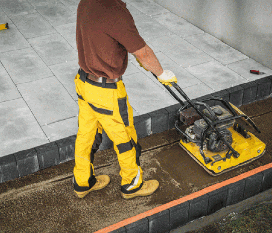 man using a compactor machine