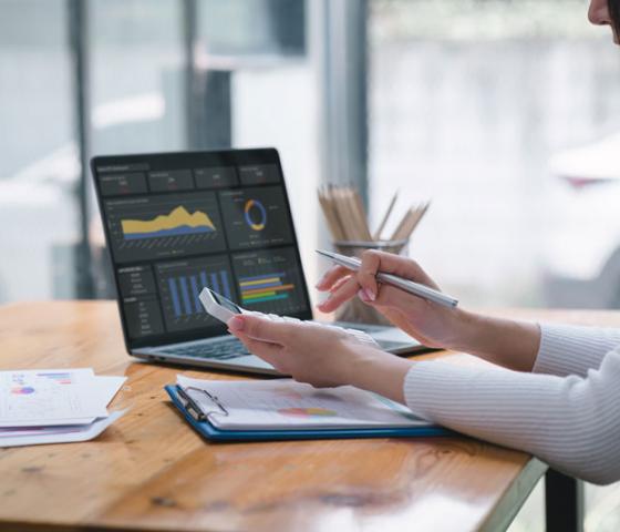 woman working on spreadsheets at desk