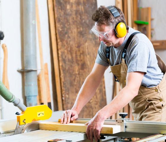 Carpenter measuring wood