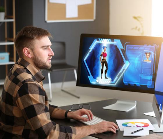 Male video games designer working in studio