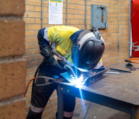 person welding