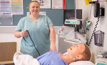 Lecturer, Kaleesha Johnson in classroom hospital setting